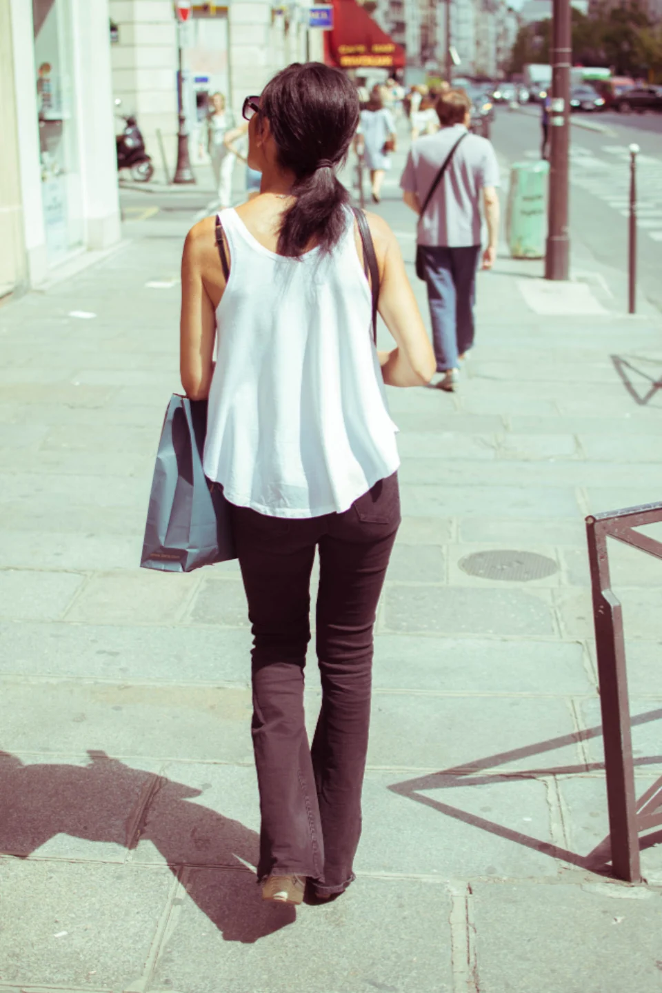Woman walking with a shopping bag